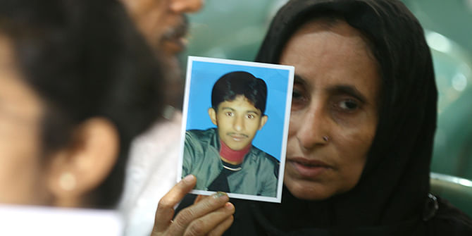In tears the parents of victims of enforced disappearances at the Jatiya Press Club auditorium, where about 100 families of victims gathered to observe the UN's International Day of the Victims of Enforced Disappearances on August 30. Photo: Palash Khan