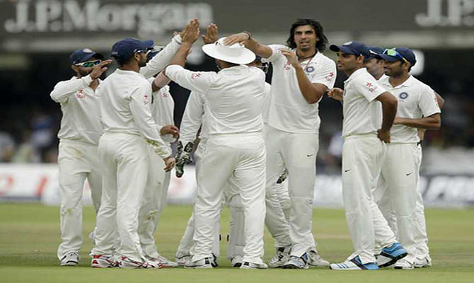 The Indian team celebrates after Ishant Sharma took the wicket of England wicketkeeper Matt Prior at Lord’s cricket ground in London on Monday, July 21, 2014 . Photo: AP