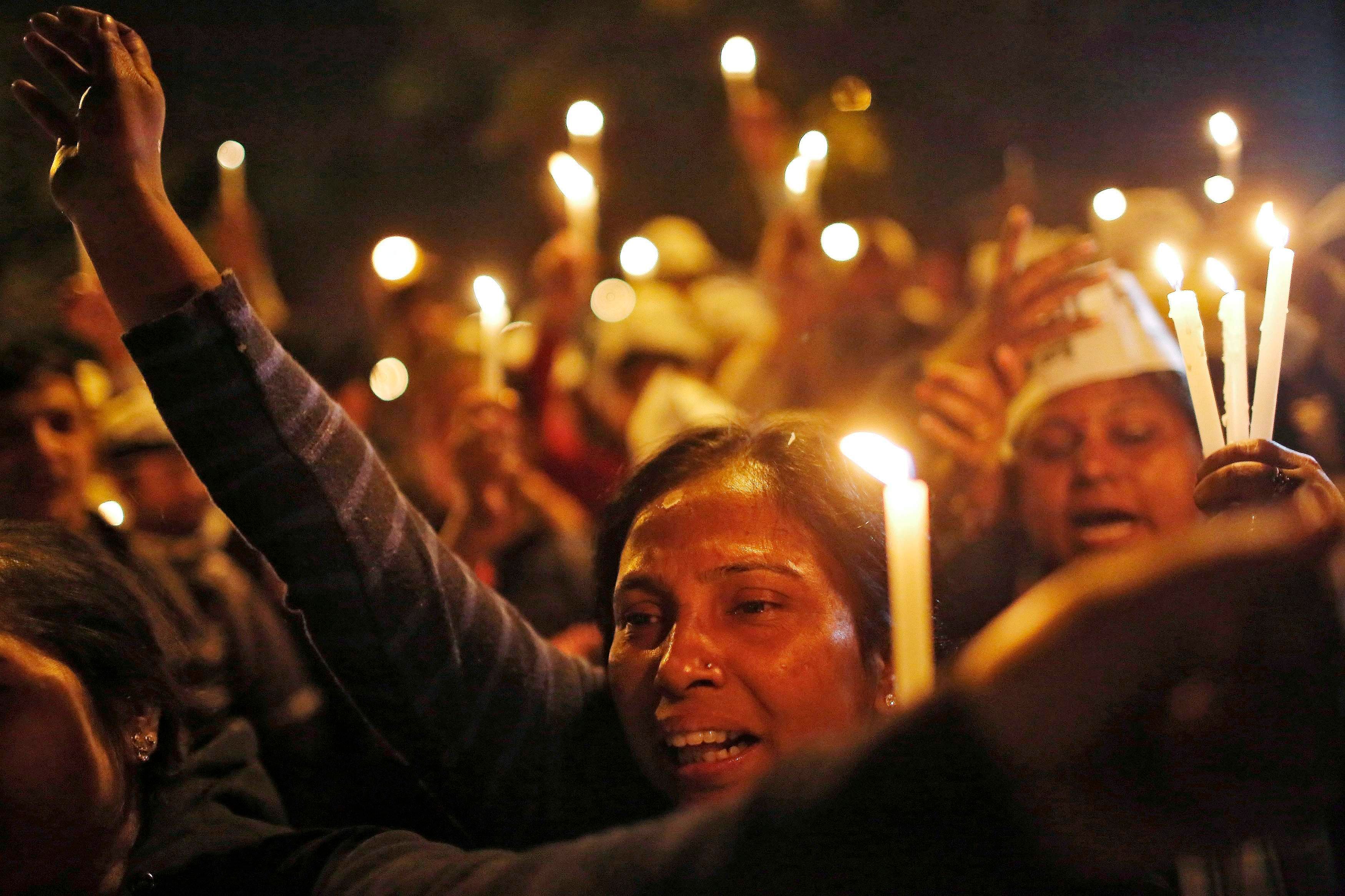 File photo showing supporters of Aam Aadmi (Common Man) Party (AAP) shout slogans as they participate in a candle light vigil during a protest against the rape of a female passenger, in New Delhi December 8, 2014. Photo: Reuters