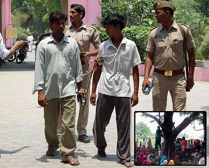 Indian policemen show two men (L and 2nd R), who are accused of gang raping and hanging two girls (inset), to the media at Budaun district in the northern Indian state of Uttar Pradesh on Friday. India's new home minister weighed in a grisly case in which two teenage girls were raped and hanged from a tree this week, as public anger and political controversy over the attack gain momentum. Photo: Reuters