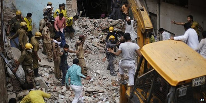 Rescuers are trying to pull bodies and survivors from under the concrete ruins of a collapsed 11-story building on Tuesday, three days after it toppled and killed dozens of people in southern India, officials said. Photo: AP
