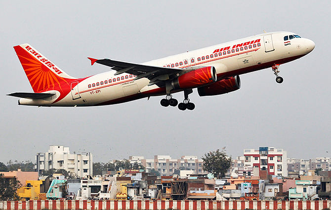 An Air India passenger plane takes off from Sardar Vallabhbhai Patel International Airport in Ahmedabad in this file photo taken January 30, 2013.  US authorities have downgraded India's aviation safety rating, citing a lack of safety oversight, meaning Indian carriers Air India and Jet Airways cannot increase flights to the US and face extra checks for existing ones.