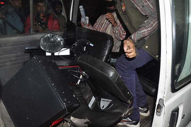 This January 16 photo shows seized computers those the law enforcers keep at their pick-up vehicle after conducting a raid at Bangla daily Inqilab office on Ram Krishna Mission Road at Motijheel in the capital. 