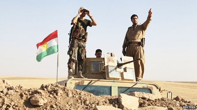 Kurdish forces watched as US air strikes hit jihadist positions Khazer, in northern Iraq. Photo: Reuters