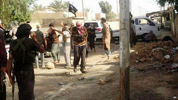 Militiamen consolidate their hold on Tikrit. Photo taken from BBC