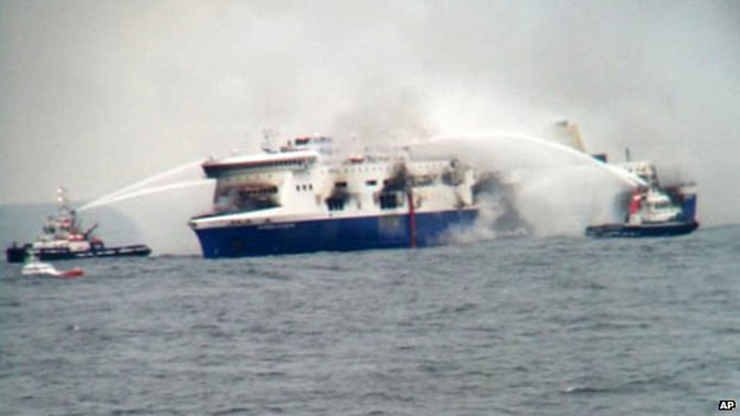 This photo taken by a nearby ship shows other vessels trying to extinguish the fire
