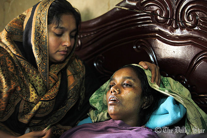 A relative consoles the shocked mother of Jihad. Photo: Star
