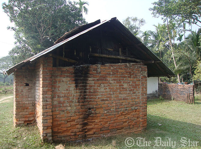 A portion of the ancestral home of High Court Judge Quazi Reza-Ul Hoque in Feni was burnt after miscreants set fire to it last night. Photos: Star