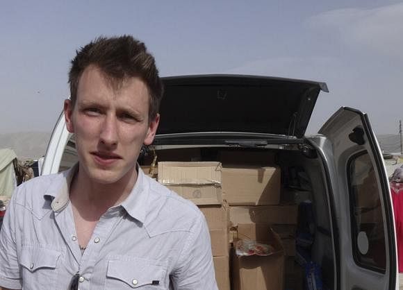 Abdul-Rahman (Peter) Kassig is pictured making a food delivery to refugees in Lebanon's Bekaa Valley in this May 2013 handout photo released by his family November 16. Photo: Reuters