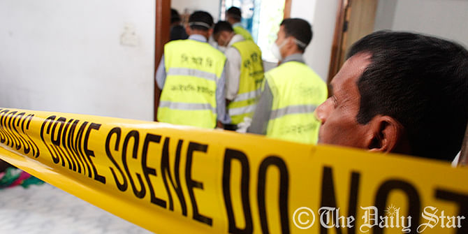 Criminal Investigation Department (CID) members collect evidence at the crime scene on the first floor of a six-storey building at Kolakandi village in South Keraniganj where bodies of four members of a family were found on Wednesday. Photo: Rashed Shumon