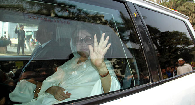 This Star file photo shows BNP Cjairperson Khaleda Zia waves at the media while she was on her way to appear before a court in the capital to fight graft charges against her.