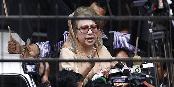 Confined to her Gulshan office since January 3, BNP Chairperson Khaleda Zia speaks to her party men and the press on January 8 afternoon from inside the office premises, cordoned off by law enforcers. Photo: Star