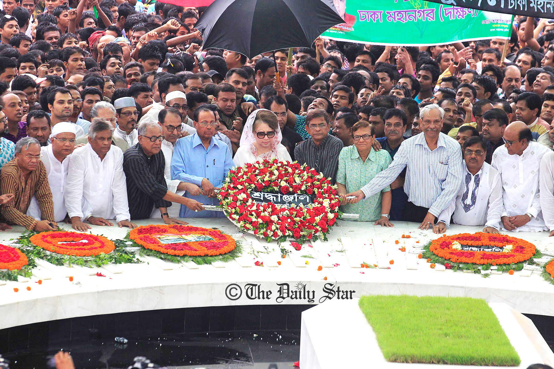 BNP Chairperson Khaleda Zia places a wreath at the grave of the party founder Ziaur Rahman marking his 33rd death anniversary at Sher-e-Bangla Nagar in the capital on Friday. Photo: Firoz Ahmed