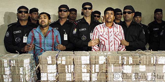 Rapid Action Battalion showcase retrieved money of Kishoreganj Sonali Bank heist at its headquarters in capital's Uttara on January 28. Photo: Star file