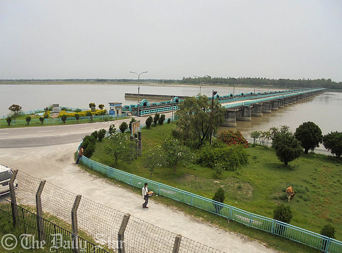 Red alert was imposed at Teesta Barrage area due to heavy water current from upstream as all the gates of Indian Gajoldoba Barrage were kept open at Dowani village of Hatibandha upazila in Lalmonirhat on early Saturday. Photo: Star