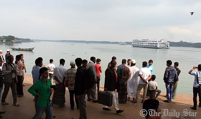People are seen waiting for launches at terminal in Barisal Sunday. The authorities have suspended the service on Barisal-Dhaka route since evening today. Photo: STAR  