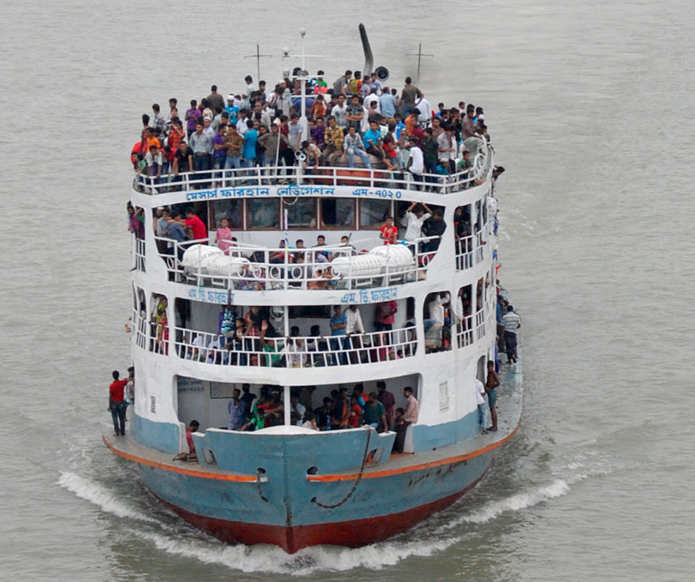 This STAR photo taken on August 6, 2013 shows passengers filling up almost every inch of a launch that set off from Sadarghat Launch Terminal in Dhaka ahead of Eid-ul-Azha and Durga Puja. 