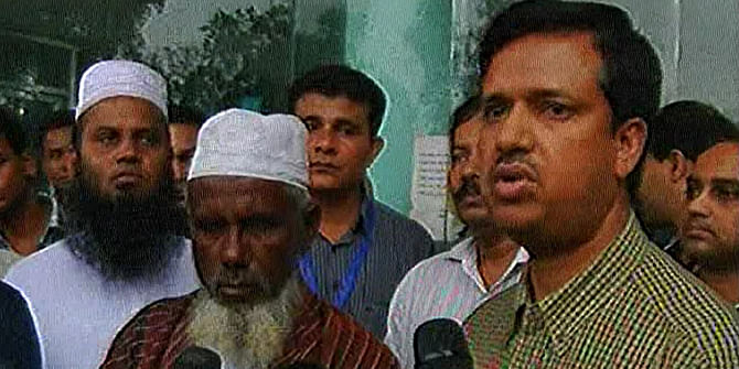 Mohammad Azharul Haque (R), joint secretary of Expatriates' Welfare and Overseas Employment ministry, talks to the reporters on Friday after handing over the bodies of two brothers, to their father (L), who died in Libya missile attack. Photo: TV grab