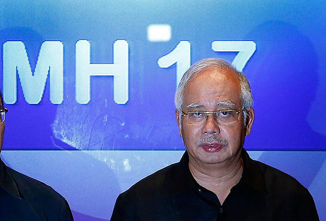 Malaysian Prime Minister Najib Razak addresses reporters at the Sama-Sama Hotel near Kuala Lumpur International Airport in Sepang July 18, 2014. Razak demanded swift justice for those responsible if Malaysia Airlines flight MH-17 that came down in Ukraine was found to have been shot down. Photo: Reuters