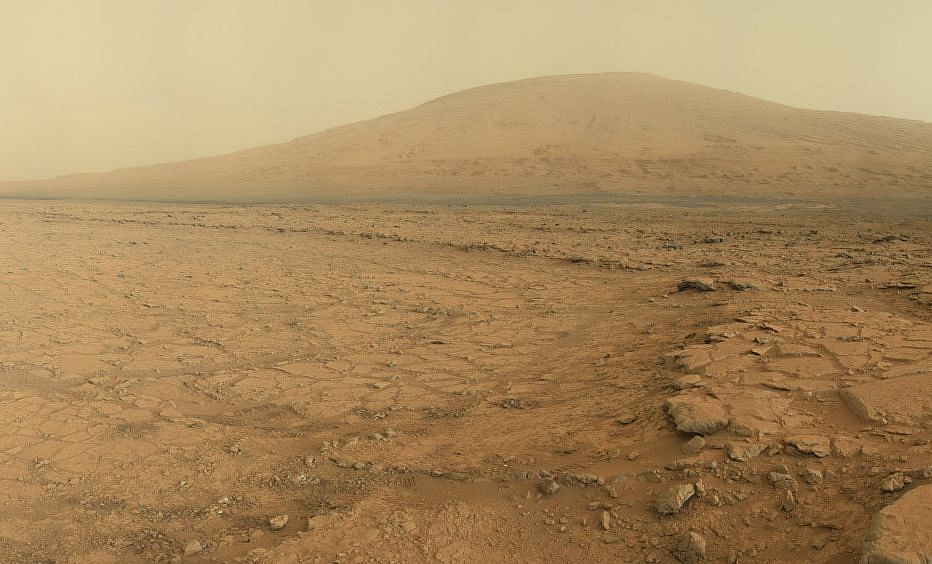 A panoramic view of the surface of Mars from the Curiosity rover. Mount Sharp can be seen in the distance. Photo taken from NYT/NASA