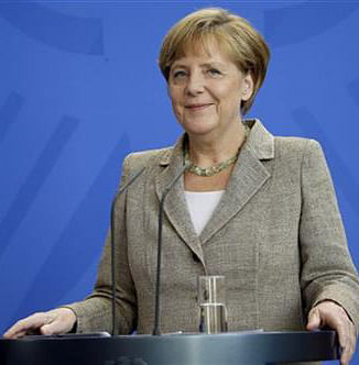 German Chancellor Angela Merkel smiles during a joint news conference with the Prime Minster of Moldova Iurie Leanca as part of a meeting at the chancellery in Berlin, Germany, Thursday, July 10. Photo: AP