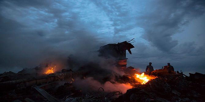 People walk amongst the debris at the crash site of a passenger plane near the village of Grabovo, Ukraine, on July 17, 2014. Photo: AP 
