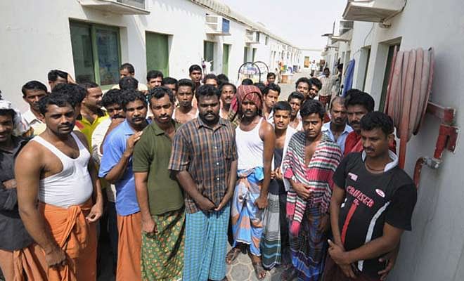 This file photo shows workers stand inside the Portland labour camp in an industrial area on the outskirts of Sharjah. Gulf nations have relied heavily on the supply of cheap labour from Asia to build their vast housing and infrastructure needs. Photo: Reuters