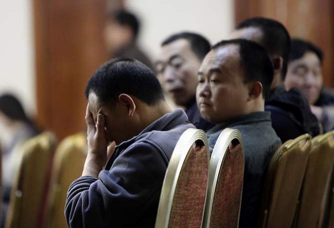 Relatives of passengers onboard Malaysia Airlines Flight MH370 attend a briefing given by Malaysian representatives at Lido Hotel in Beijing March 29. Photo: Reuters