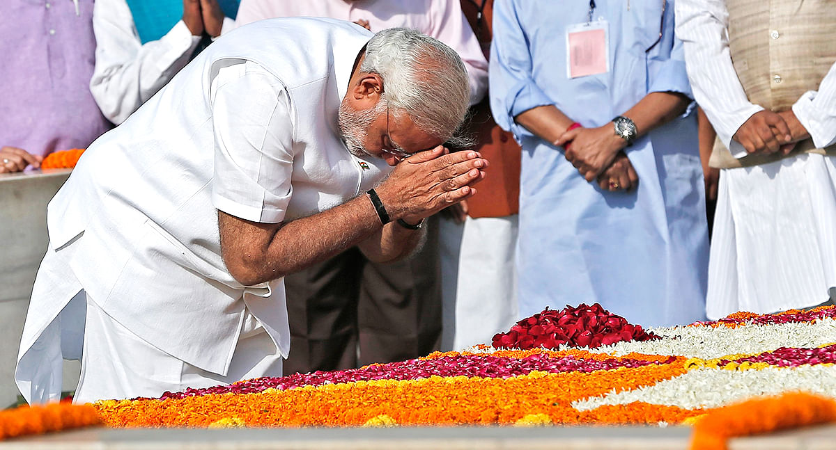 Indian Prime Minister-designate Narendra Modi pays his respects at the Mahatma Gandhi memorial at Rajghat ahead of his swearing-in ceremony, in New Delhi Monday. Photo: Reuters