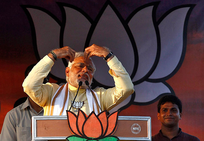 Hindu nationalist Narendra Modi, the prime ministerial candidate for India's main opposition Bharatiya Janata Party (BJP), gestures as he addresses an election campaign rally in Barasat, north of Kolkata May 7, 2014. Photo: Reuters