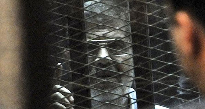 Morsi was held in a glassed-in cage for his last court appearance. Photo: AP