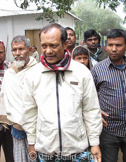 Law enforcers (not seen) take Jeweller Mridul Kumar Chowdhury from Devpur Police Outpost to Chittagong this morning. Six days after his abduction a night guard found Mridul alive at Kangshanagar Bazar in Burichang upazila of Comilla. Photo: Star