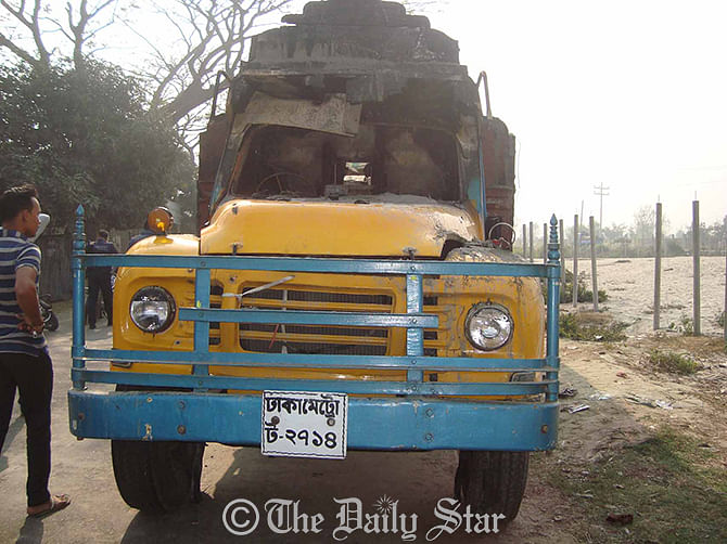 The truck came under petrol bomb attack by pickets in Gazaria upazila of Munshiganj Monday. Photo: STAR