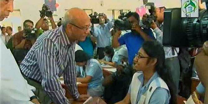Education Minister Nurul Islam Nahid talks with an HSC examinee during his visit to an examination centre in the capital on Thursday morning. Photo: TV grab