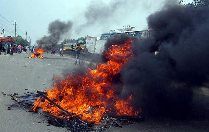 This April 28 Banglar Chokh photo shows a burning tyre set fire by locals on Dhaka-Chittagong highway in Narayanganj. Locals block the highway protesting what they said abduction of five people including a ward councilor of Narayanganj City Corporation. 