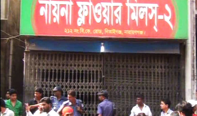 Police visit Nayna Flower Mills in Narayanganj town after two employees of the mill were found dead there on Sunday. Photo: TV grab