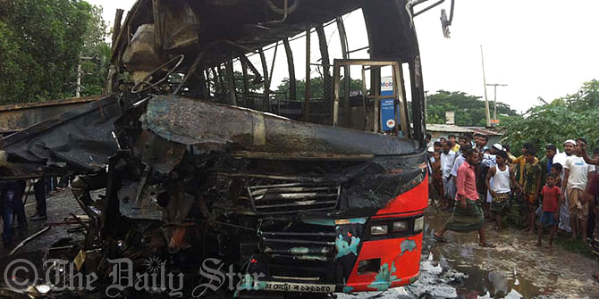 Locals gather around one of the badly damaged passenger buses which went in flames after a head-on collision on the Dhaka-Sylhet highway in Karachar area of Sibbari upazila in Narsingdi Wednesday afternoon. Photo: Star