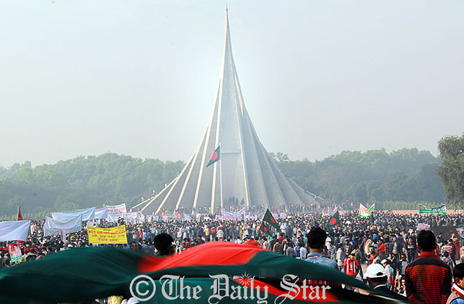 Bangladeshi people throng National Mausoleum in Savar, on the outskirts of the Dhaka, to pay tributes to the martyrs marking the 44th victory day on December 16, 2014. Photo: Palash Khan