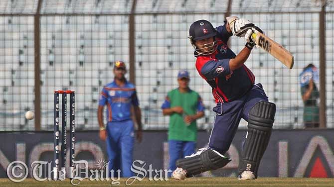 SP Khakurel of Nepal hits a boundary on in Nepal's total of 141 as they beat Afghanistan by 9 runs in Thursdaty's match of the World T20 in Chittagong. Photo: Firoz Ahmed