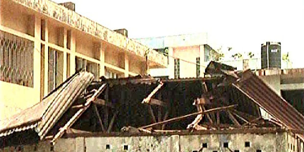 A tin-shed roof of a building was damaged in a nor’wester in Netrakona. Photo: TV grab