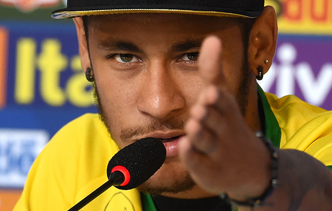 Brazil's forward Neymar gestures during a press conference in Teresopolis on July 10, 2014, during the FIFA World Cup. Brazil will face Netherlands on July 12, in the third place play-off for the FIFA World Cup tournament at The Mané Garrincha National Stadium in Brasilia. Photo: AFP/ Getty Images