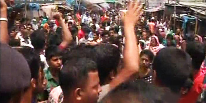 Several hundred local people stage demonstration at Sanapara area in Narayanganj since Friday morning protesting abduction of a businessman last night from there. Photo: TV grab