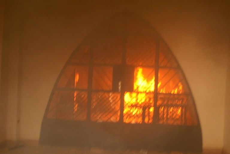 A ransacked church burns after it was set ablaze, as thousands of protesters gathered following Friday prayers to vent anger at the depiction of the prophet in the publication of a cartoon of the Prophet Mohammed in the latest edition of the French satirical weekly, Charlie Hebdo, on January 16, 2015 in Zinder. Photo: AFP