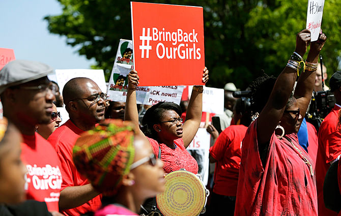 Protesters march in support of the girls kidnapped by members of Boko Haram in front of the Nigerian Embassy in Washington May 6, 2014. Photo: Reuters