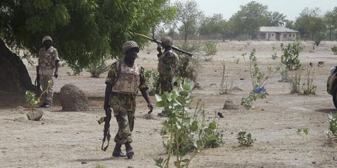 Soldiers patrol northern Nigeria in this photo from last June. Violence has longed plagued the area, and more than 100 were killed this week by gunmen on motorcycles. Photo: Reuters 