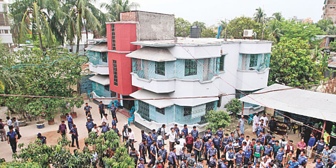 This Star photo taken on May 3 shows a large number of law enforcers conducting a search operation at the house of Nur Hossain, prime accused in the Narayanganj 7-murder cases. Police collected evidence and arrested 11 people at the house.