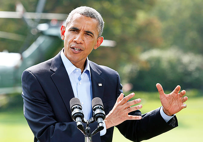US President Barack Obama speaks on the situation in Iraq on the South Lawn of the White House before his departure for vacation at Martha's Vineyard, in Washington August 9, 2014. Photo: Reuters