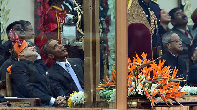Indian Prime Minister Narendra Modi (L) talks with US President Barack Obama (2L) while watching the fly-past as India President Pranab Mukherjee (R) looks on during India's Republic Day parade on Rajpath in New Delhi on January 26, 2015. Photo: AFP