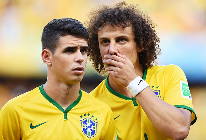 Oscar (L) and David Luiz of Brazil look on during the 2014 FIFA World Cup Brazil Quarter Final match between Brazil and Colombia at Castelao on July 4, 2014 in Fortaleza, Brazil. Photo: Getty Images