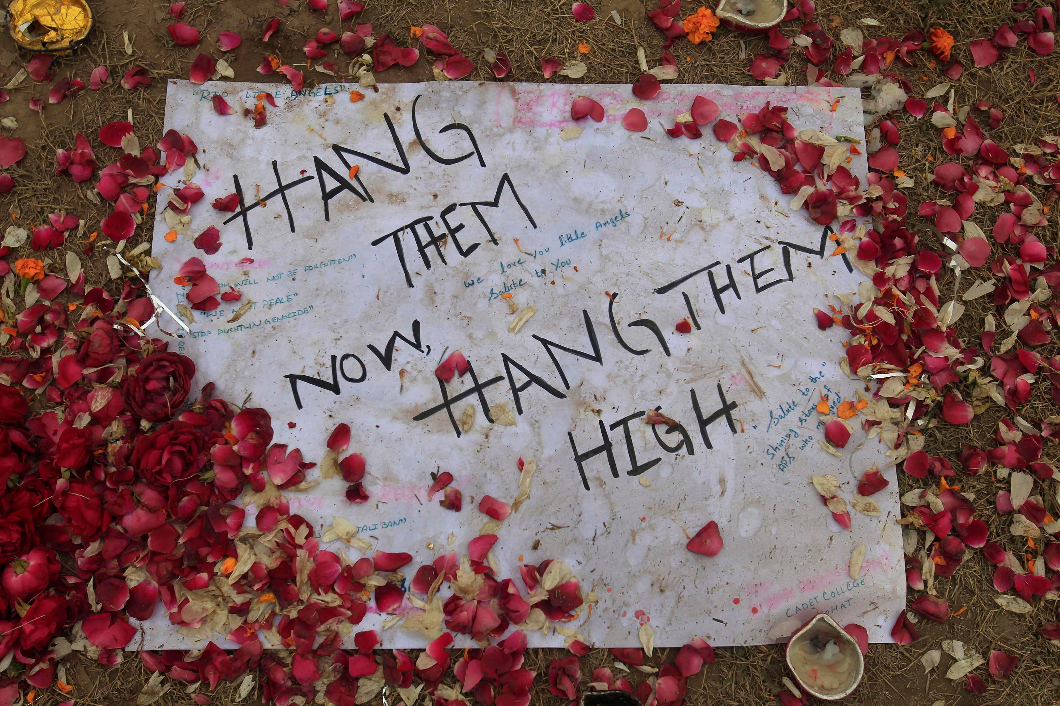 A note is pictured on the ground at the entrance of the Army Public School, which was attacked by Taliban gunmen, in Peshawar December 22, 2014. Photo: Reuters